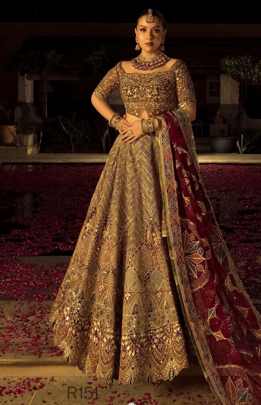 Woman in an ornate traditional outfit with a dark background
