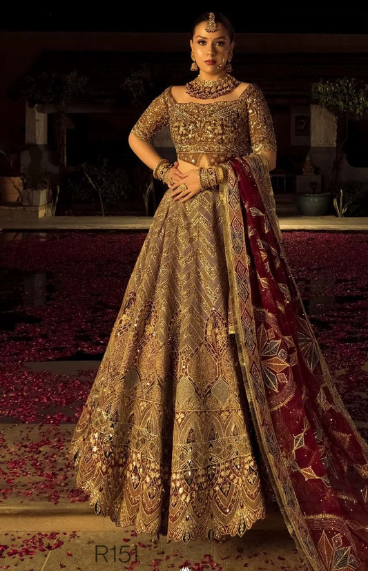 Woman in an ornate traditional outfit with a dark background