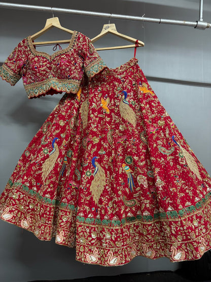 Red embroidered traditional outfit on hangers against a gray background