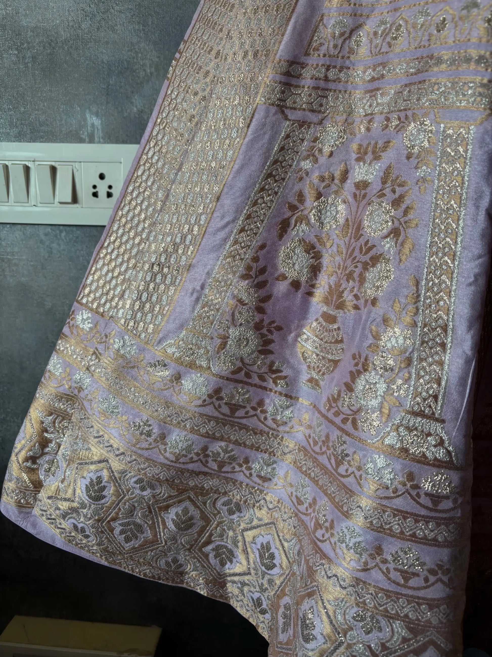 Decorative fabric with intricate patterns on a plain background