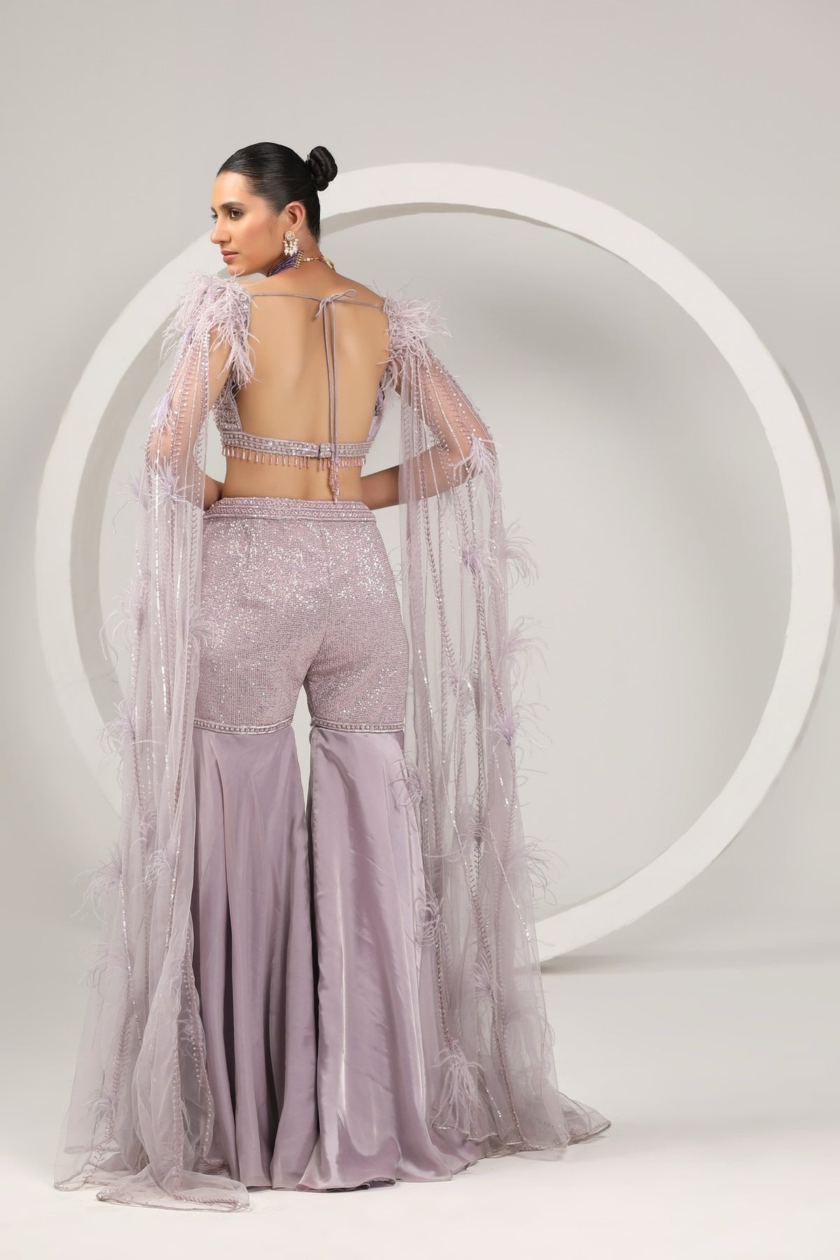 back of women wearing lavender outfit